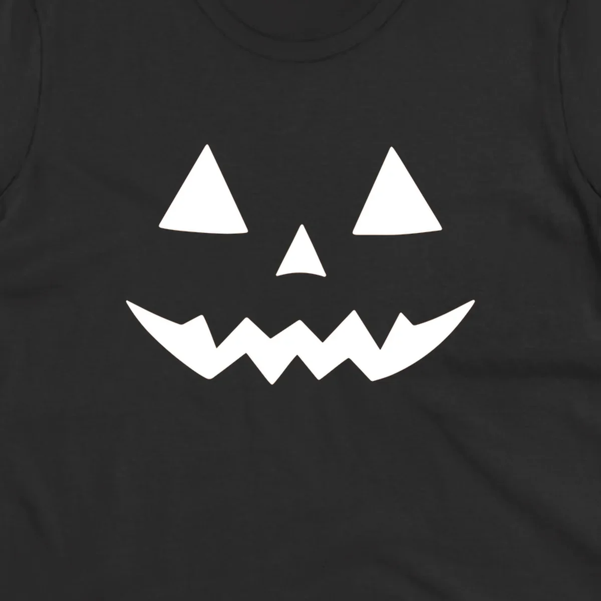 Classic jack-o-lantern face with triangle eyes and jagged mouth graphic.