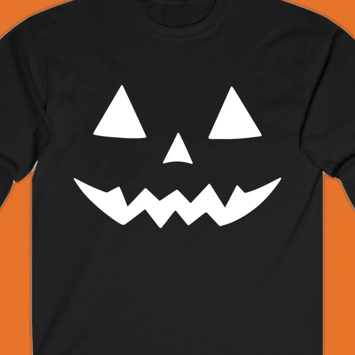 Classic jack-o-lantern face with triangle eyes and jagged mouth graphic.