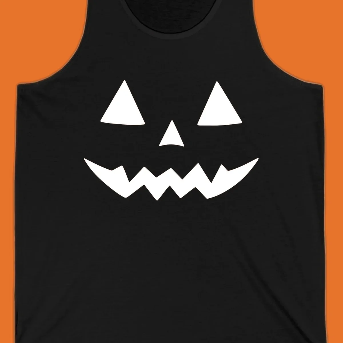 Classic jack-o-lantern face with triangle eyes and jagged mouth graphic.