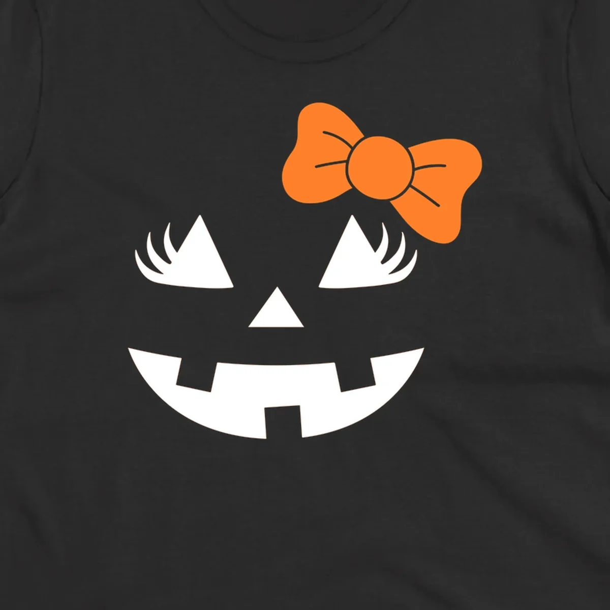 Cute halloween pumpkin face with an orange bow graphic