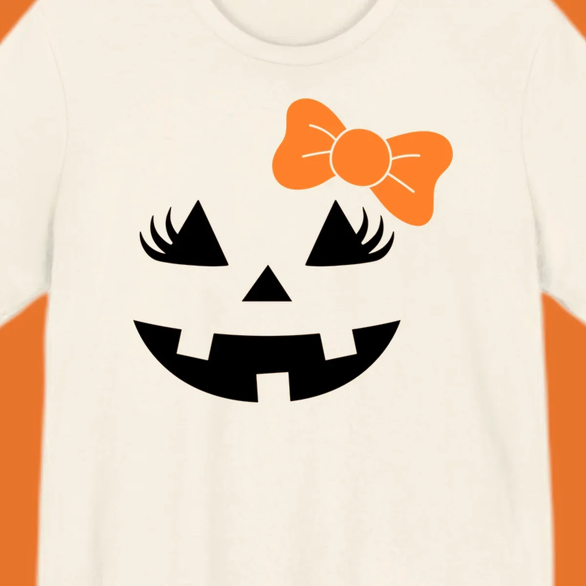 Cute halloween pumpkin face with an orange bow graphic