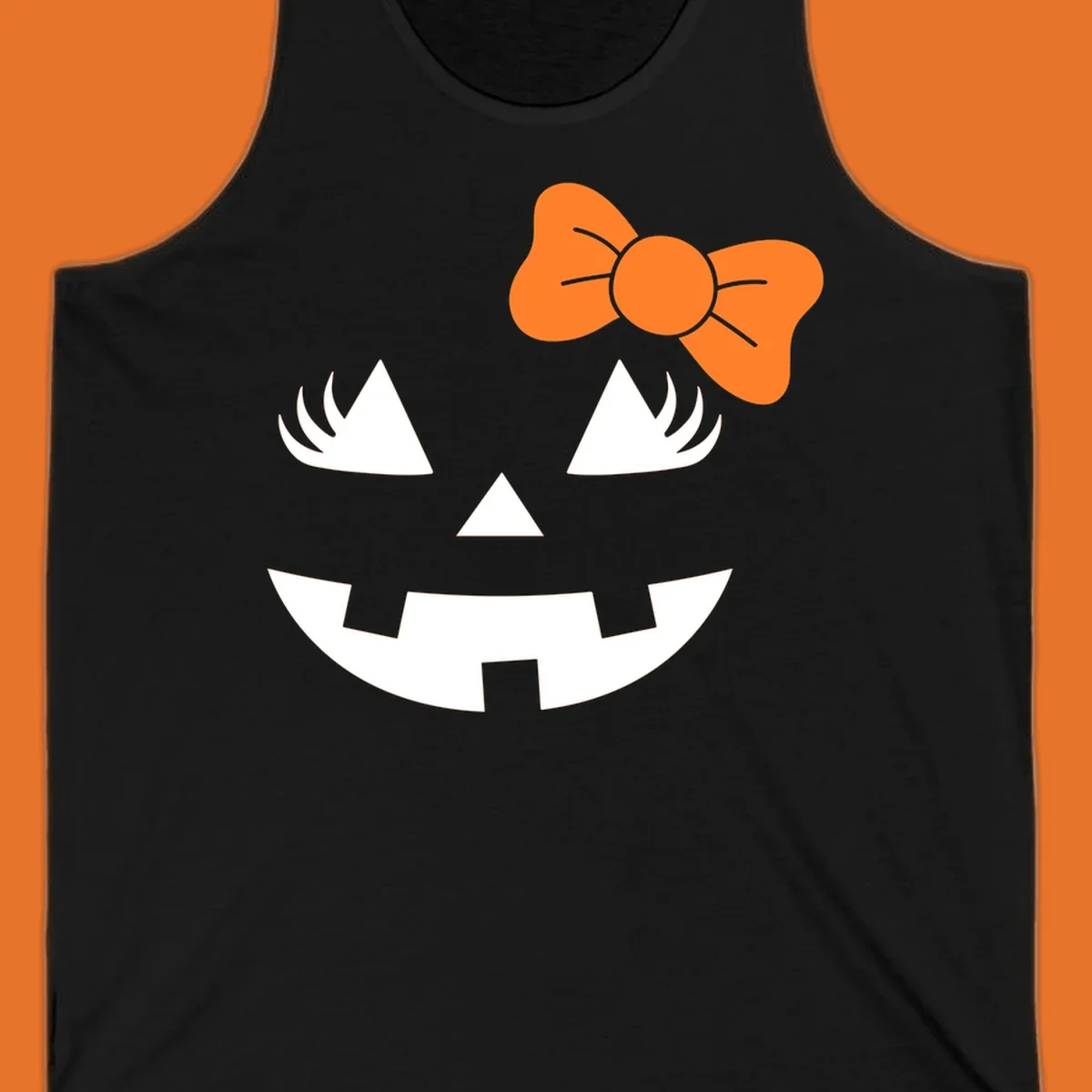 Cute halloween pumpkin face with an orange bow graphic