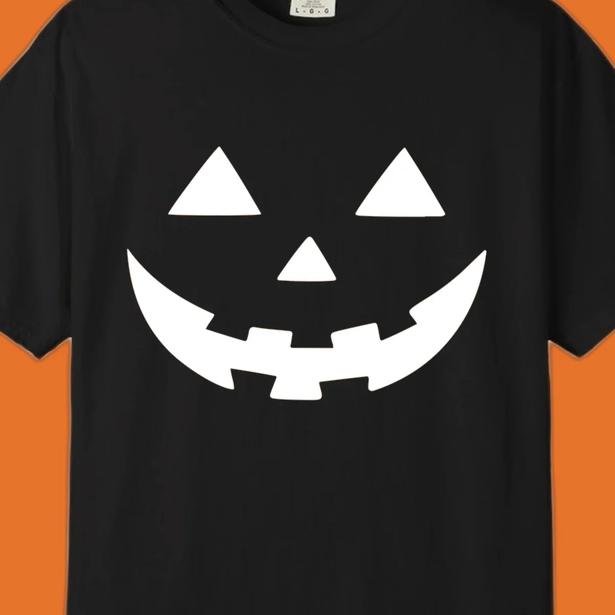 Classic jack o lantern face graphic with triangle eyes and jagged smile.