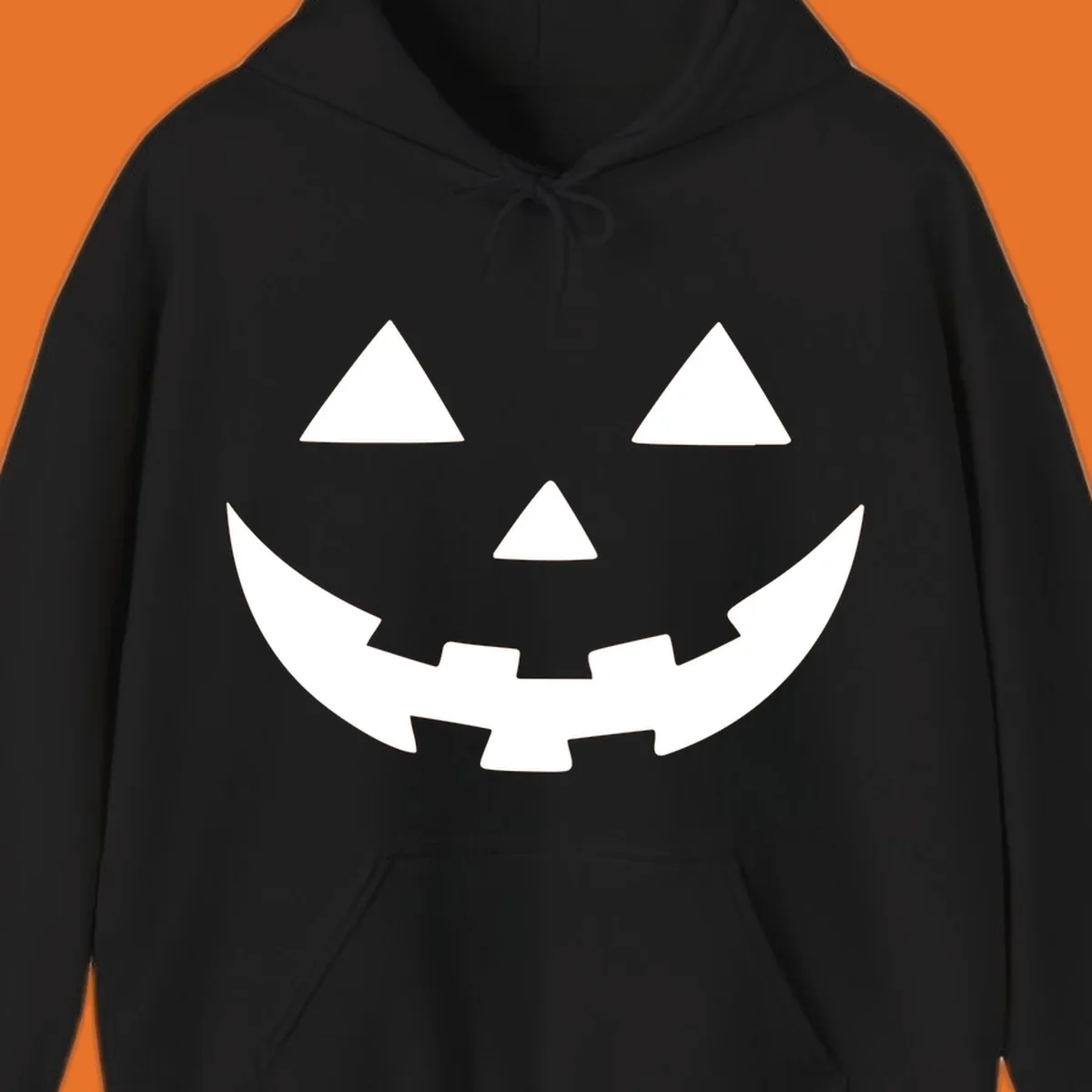 Classic jack o lantern face graphic with triangle eyes and jagged smile.