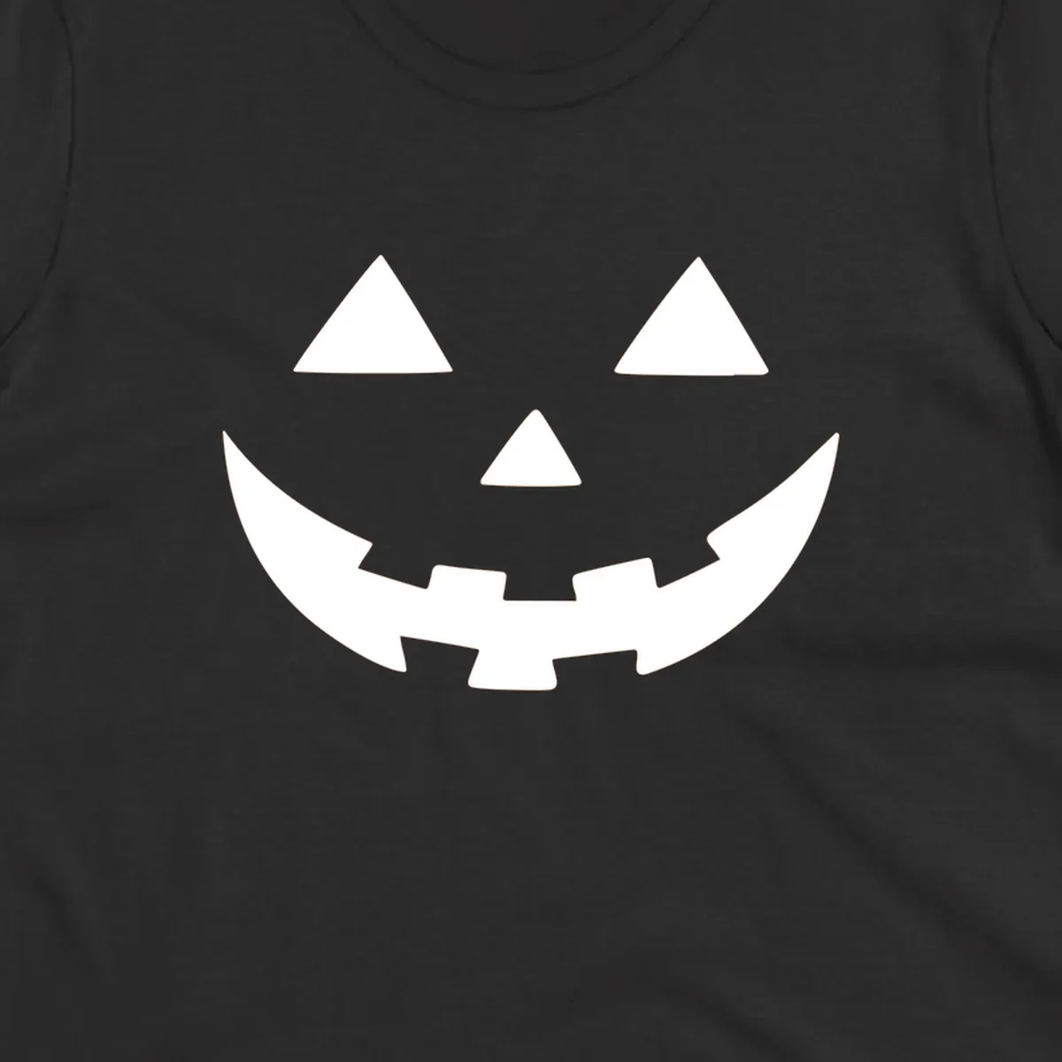 Classic jack o lantern face graphic with triangle eyes and jagged smile.