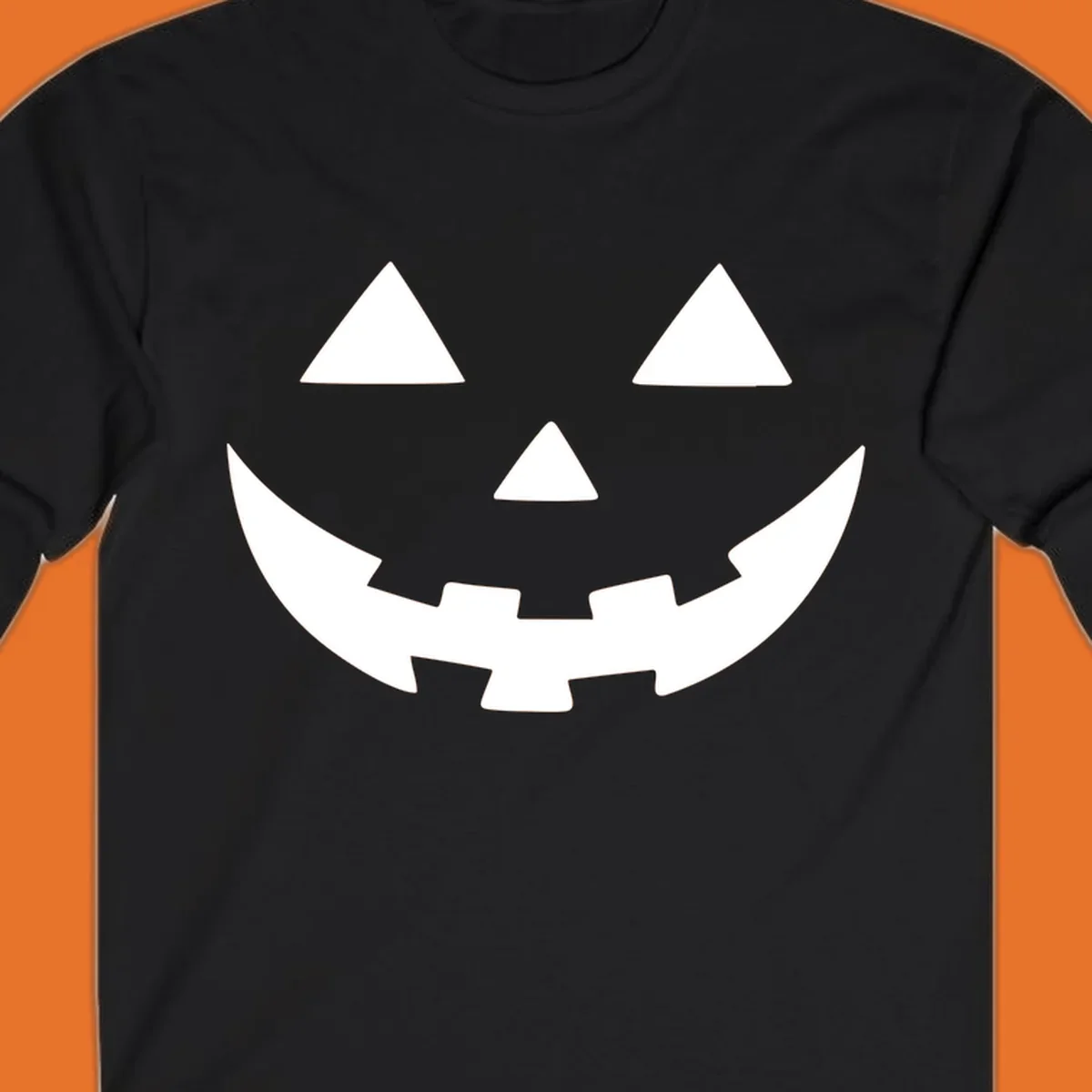 Classic jack o lantern face graphic with triangle eyes and jagged smile.