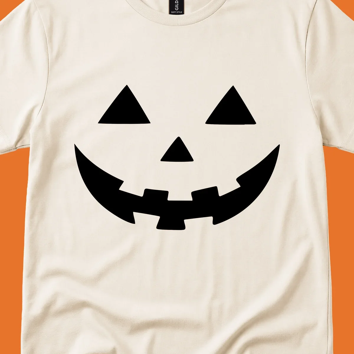 Classic jack o lantern face graphic with triangle eyes and jagged smile.