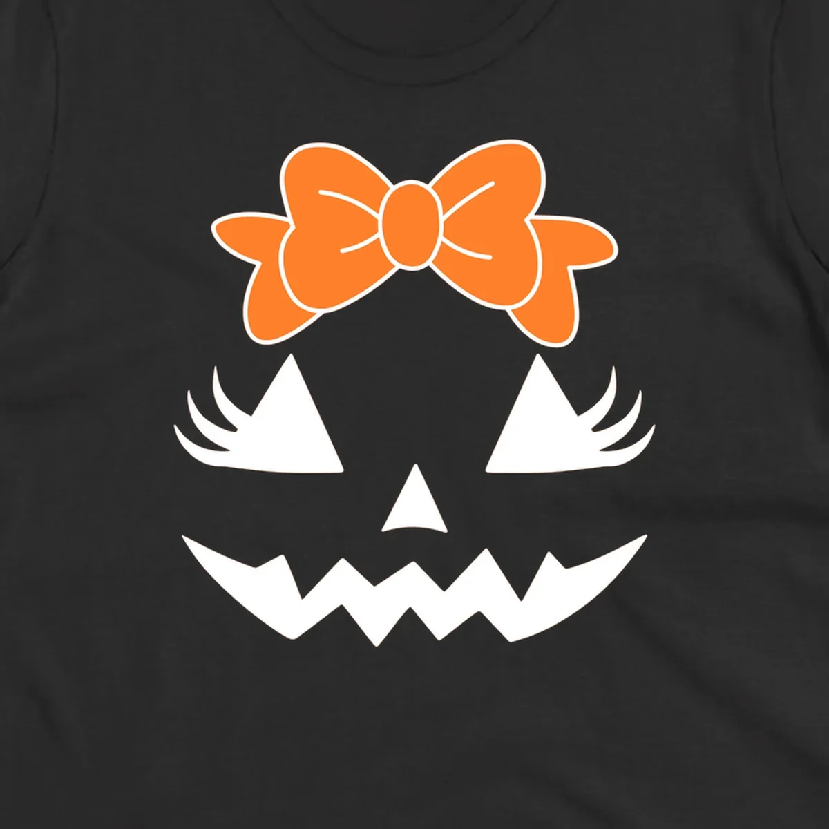 Cute pumpkin face graphic with orange bow, triangle eyes, nose, and jagged smile.