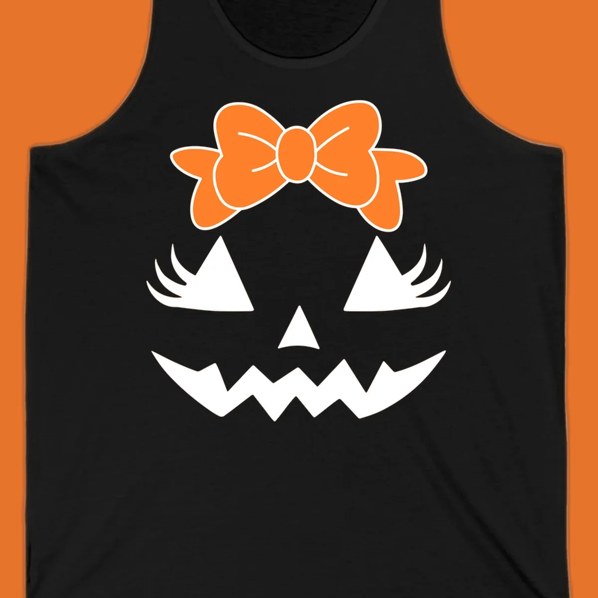 Cute pumpkin face graphic with orange bow, triangle eyes, nose, and jagged smile.