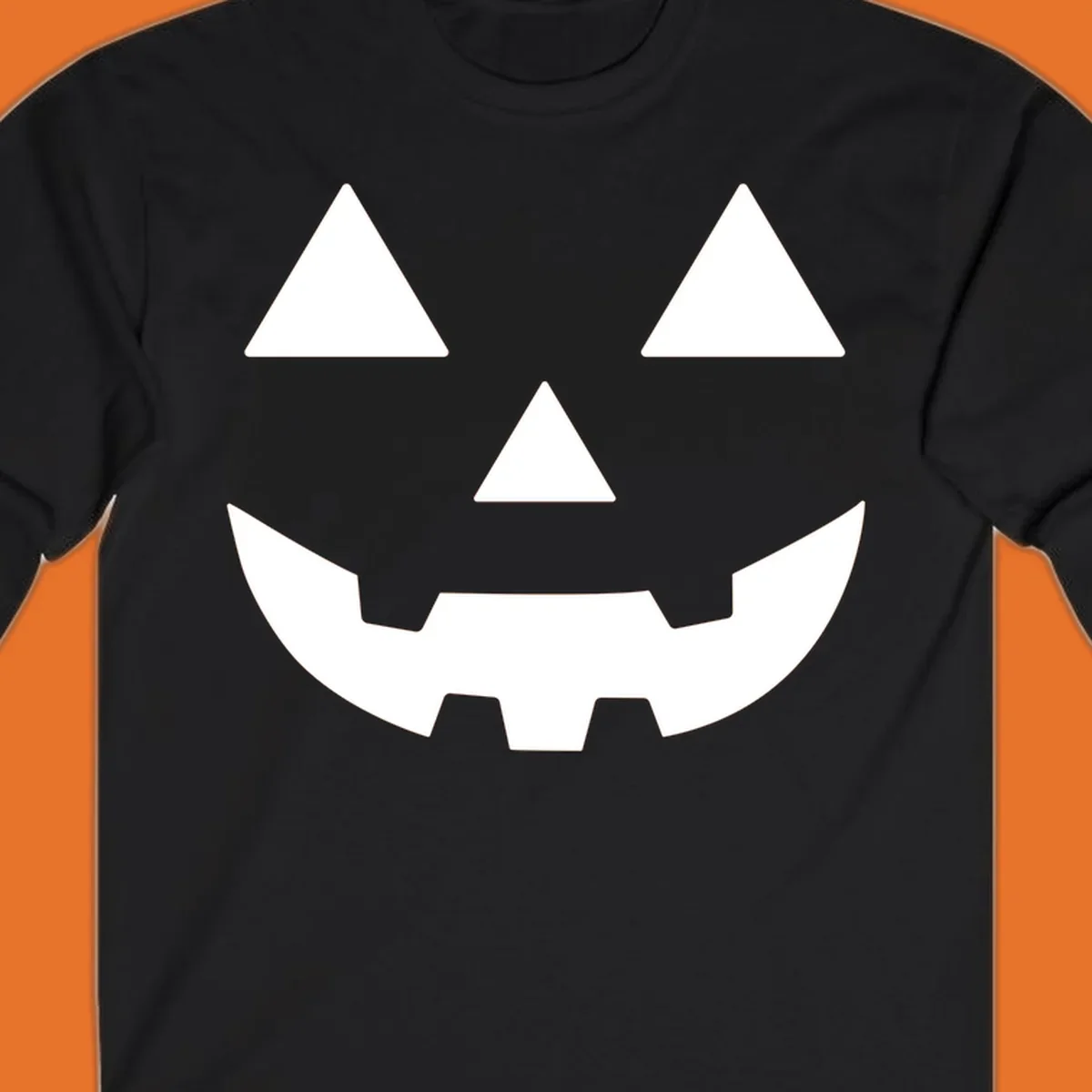 Classic Jack O' Lantern face with triangle eyes, nose, and jagged smile, rendered in white on black and black on white.