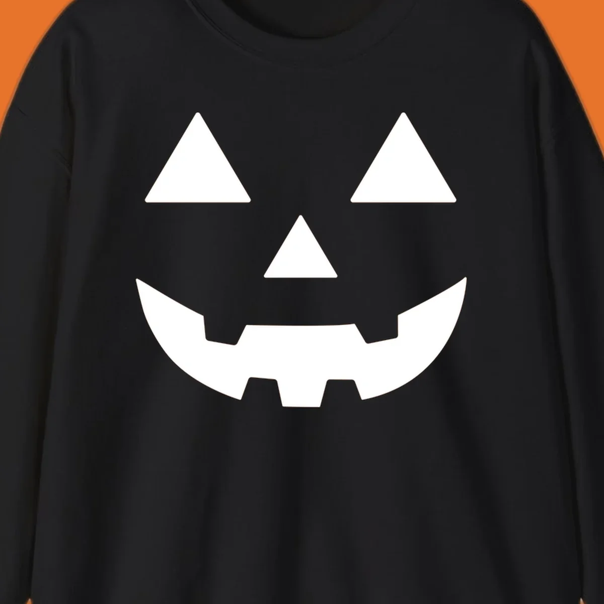 Classic Jack O' Lantern face with triangle eyes, nose, and jagged smile, rendered in white on black and black on white.