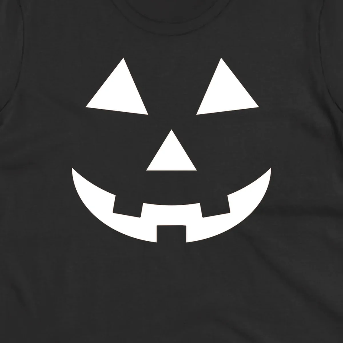 Classic jack o lantern face graphic with triangle eyes and jagged smile. Halloween design.
