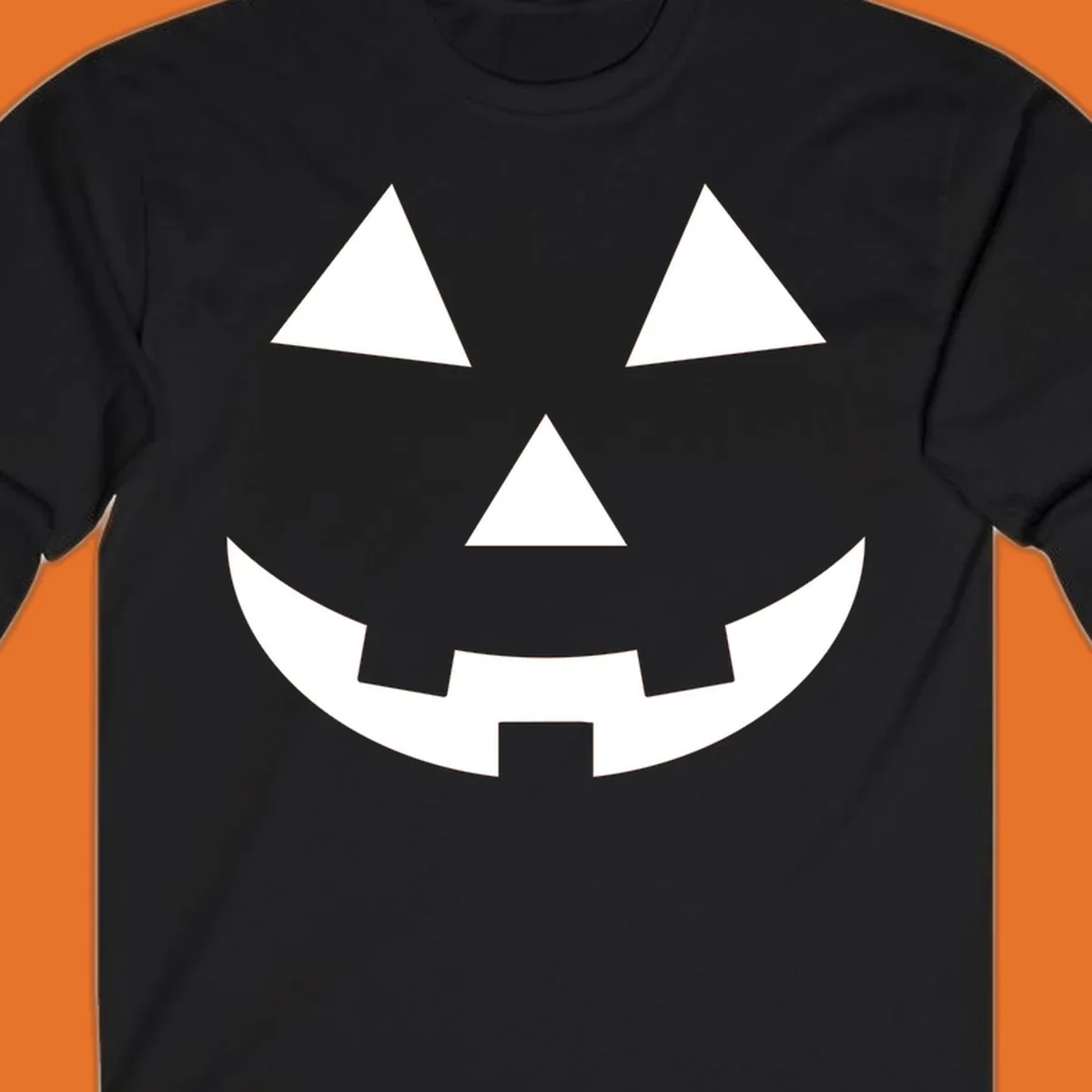 Classic jack o lantern face graphic with triangle eyes and jagged smile. Halloween design.
