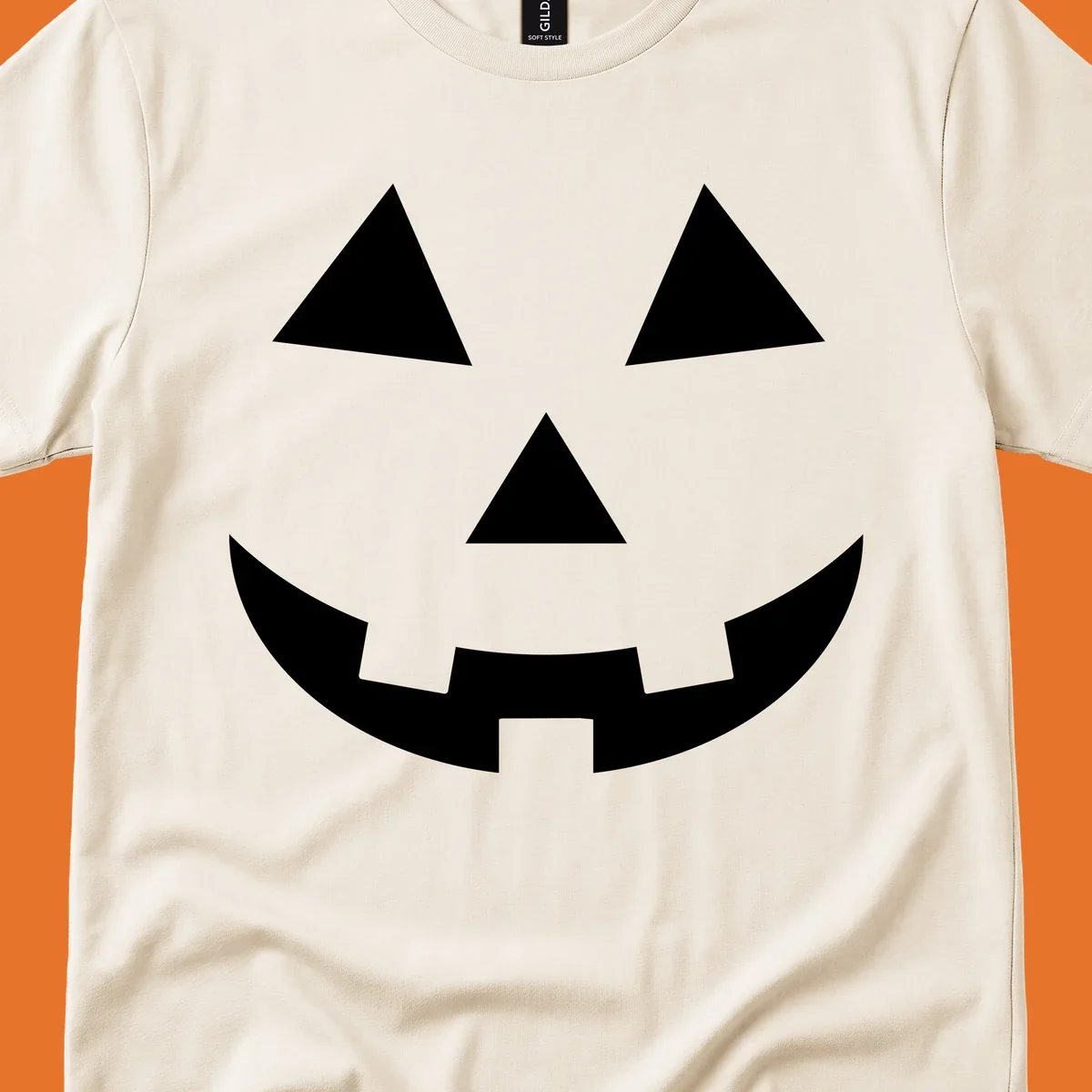 Classic jack o lantern face graphic with triangle eyes and jagged smile. Halloween design.