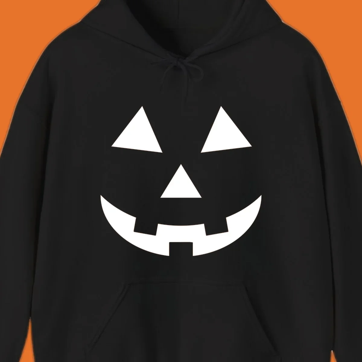 Classic jack-o-lantern face with triangle eyes and jagged smile. Halloween graphic.