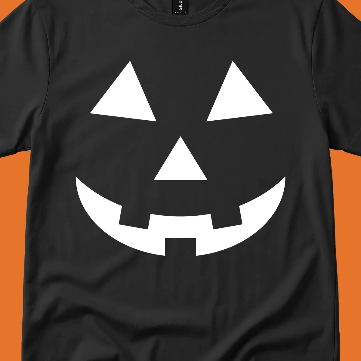 Classic jack-o-lantern face with triangle eyes and jagged smile. Halloween graphic.