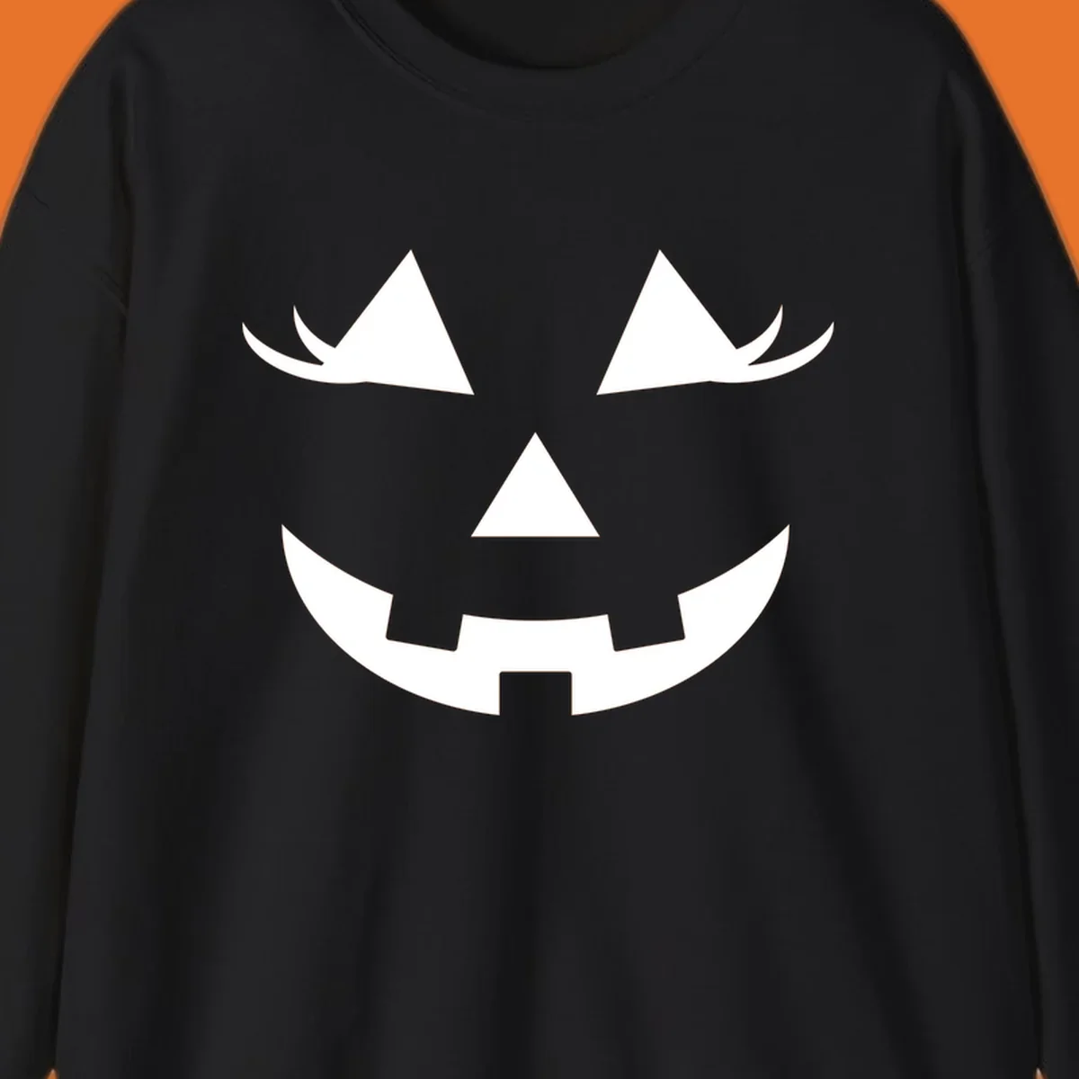 Jack o lantern face with triangular eyes and a jagged smile, classic halloween graphic.