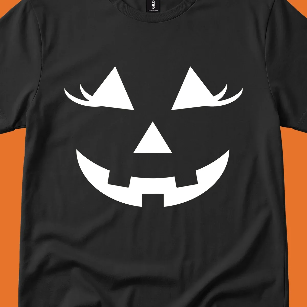 Jack o lantern face with triangular eyes and a jagged smile, classic halloween graphic.