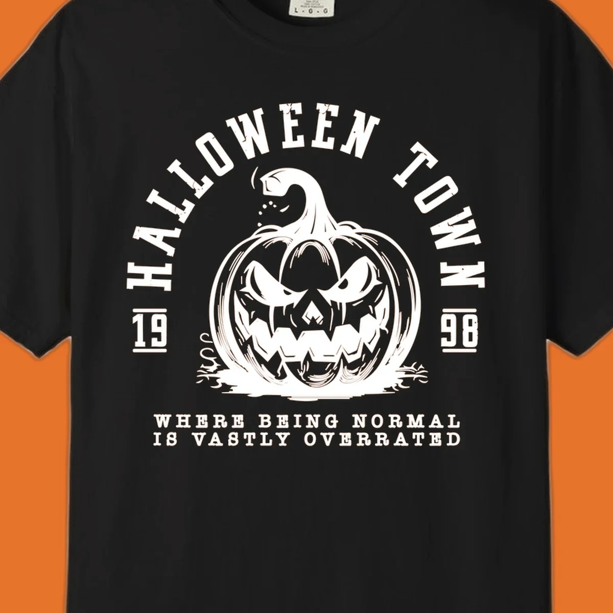 Halloween Town pumpkin illustration with text 'Where Being Normal Is Vastly Overrated'