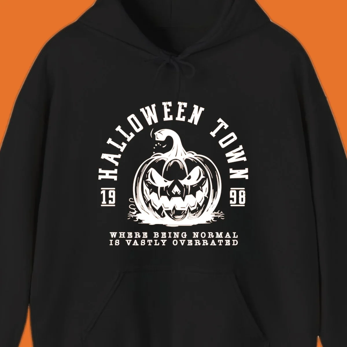 Halloween Town pumpkin illustration with text 'Where Being Normal Is Vastly Overrated'