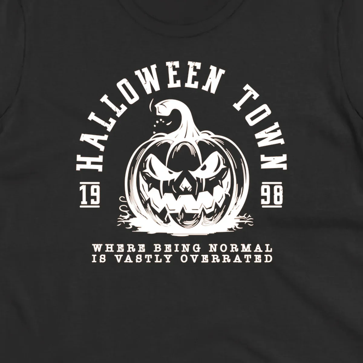 Halloween Town pumpkin illustration with text 'Where Being Normal Is Vastly Overrated'