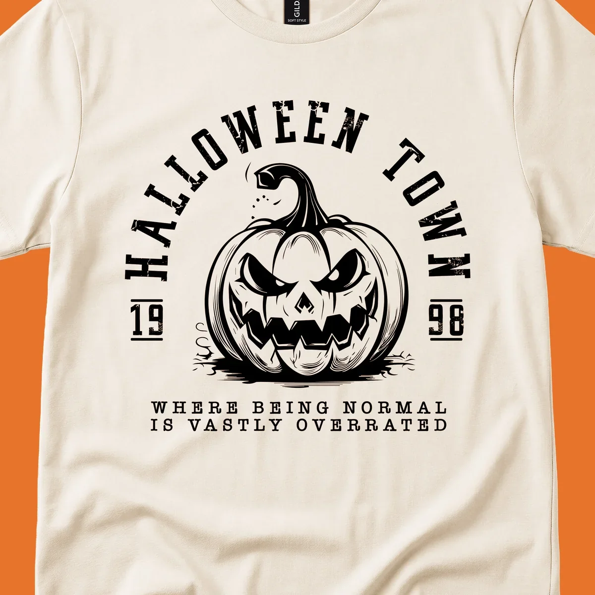 Halloween Town pumpkin illustration with text 'Where Being Normal Is Vastly Overrated'