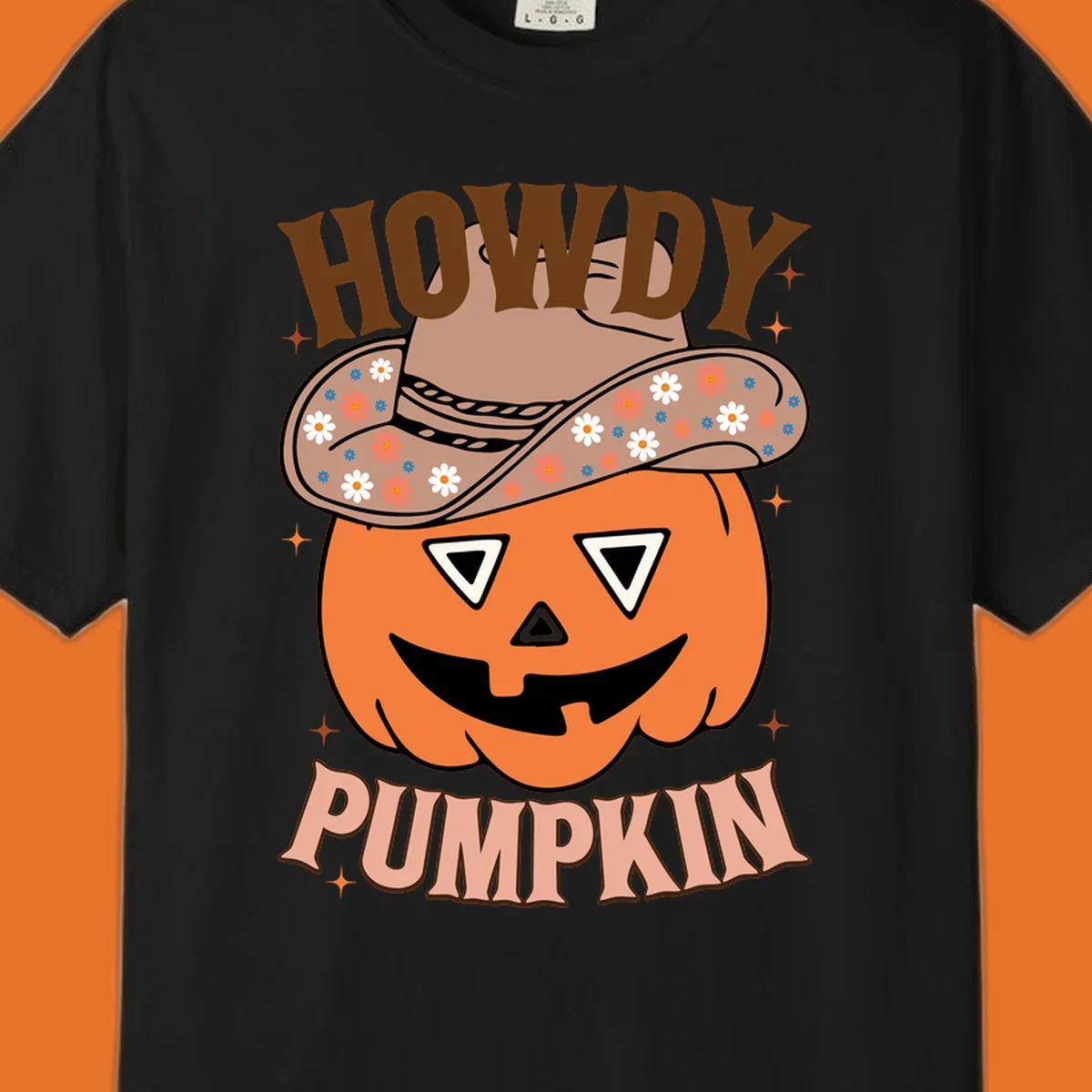 Howdy Pumpkin cowboy hat illustration for Halloween, with retro-style text and floral accents.