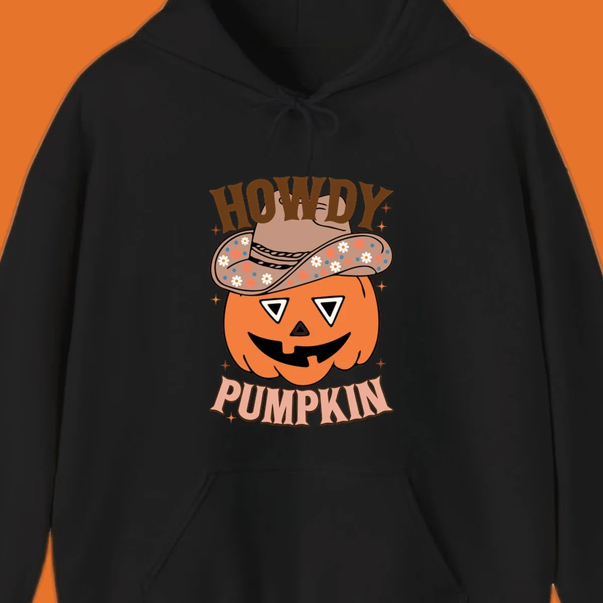 Howdy Pumpkin cowboy hat illustration for Halloween, with retro-style text and floral accents.
