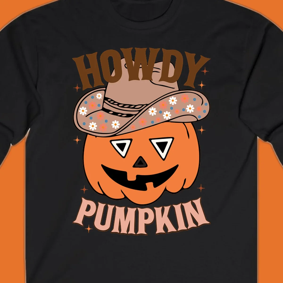 Howdy Pumpkin cowboy hat illustration for Halloween, with retro-style text and floral accents.