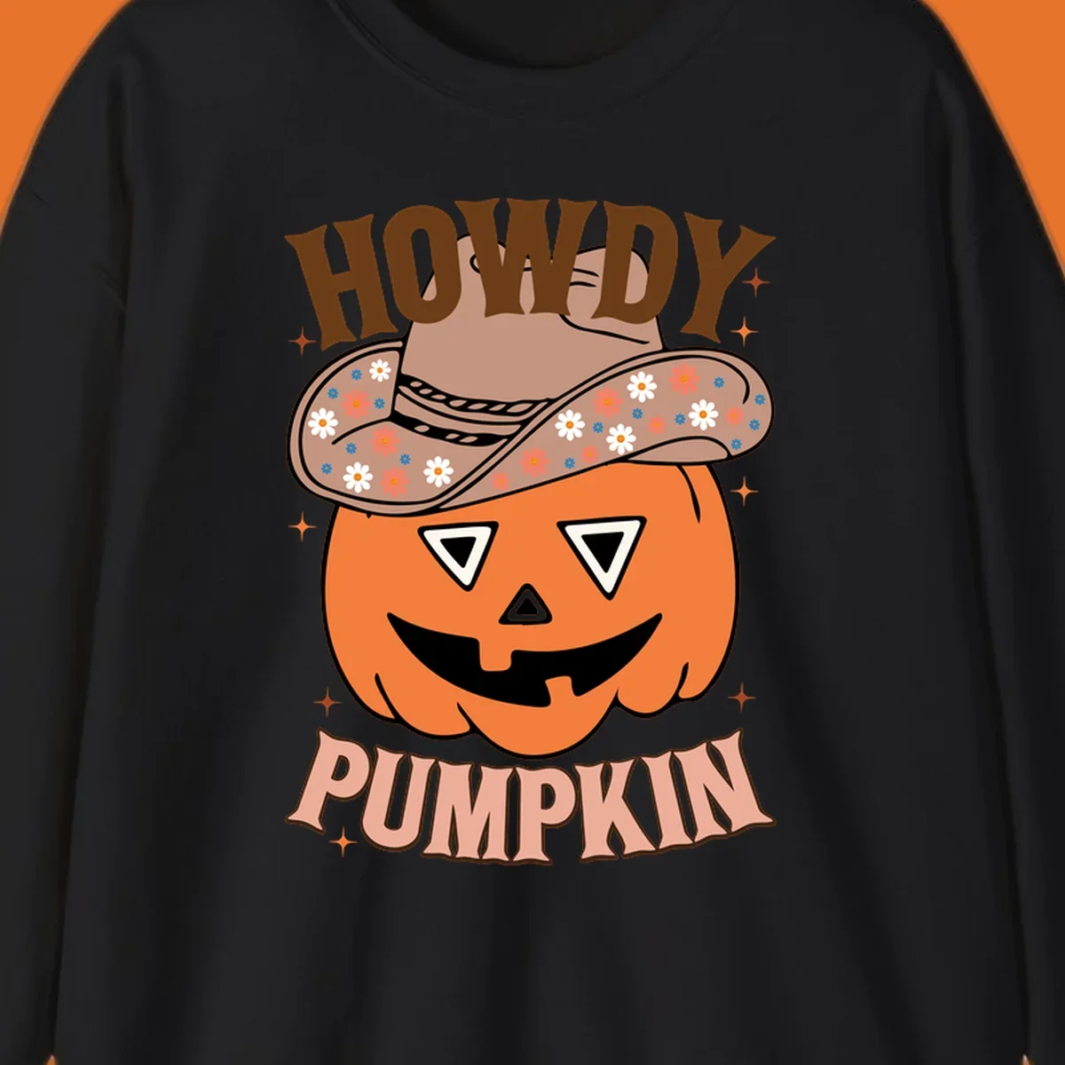 Howdy Pumpkin cowboy hat illustration for Halloween, with retro-style text and floral accents.