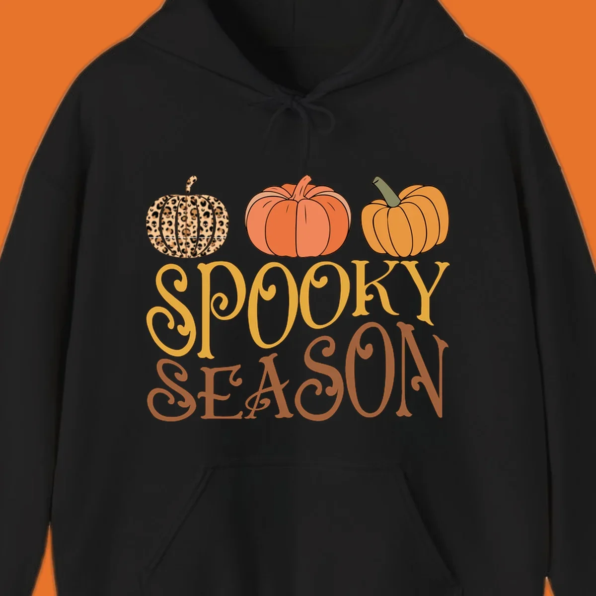 Spooky season pumpkins with leopard print and skull design, text: SPOOKY SEASON.