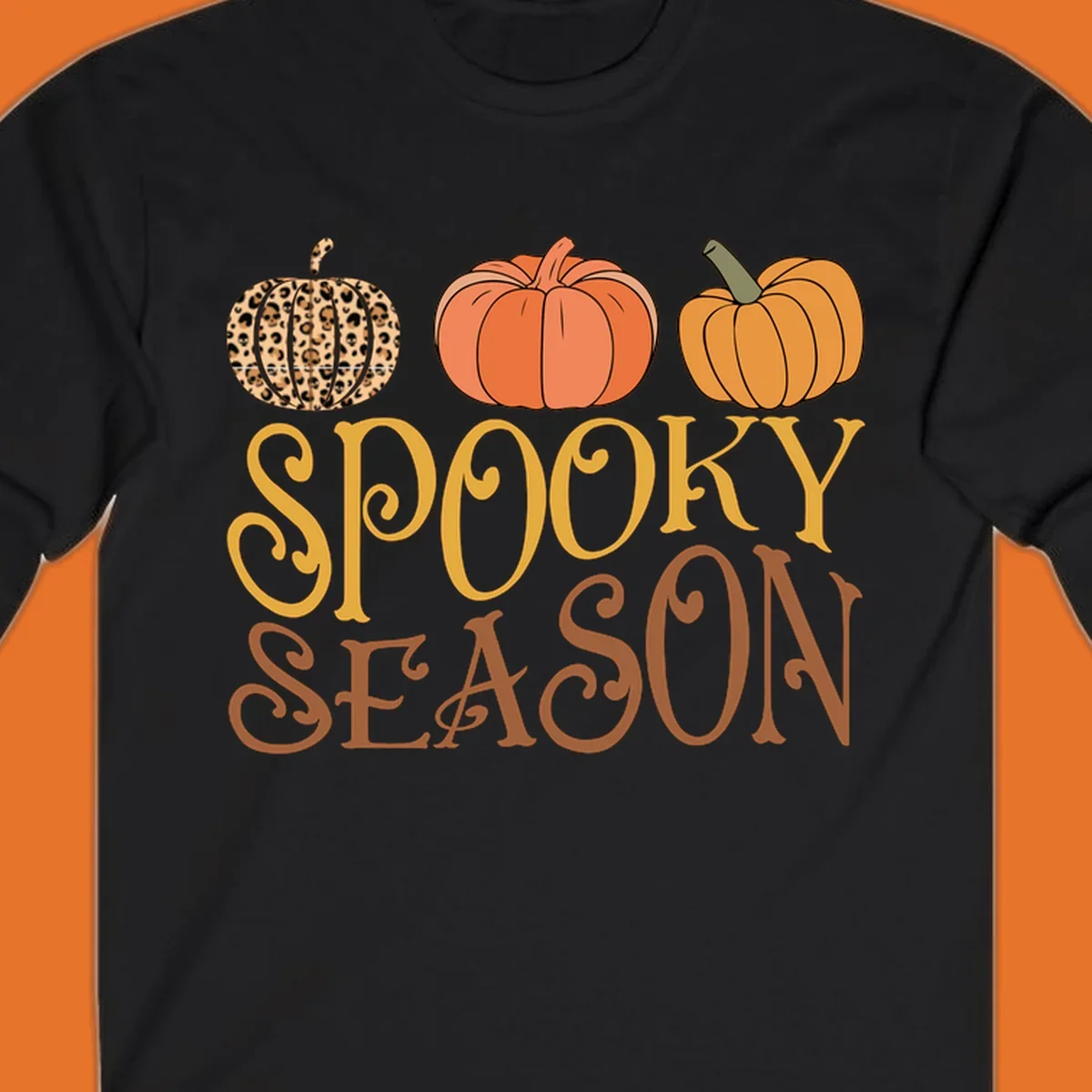 Spooky season pumpkins with leopard print and skull design, text: SPOOKY SEASON.