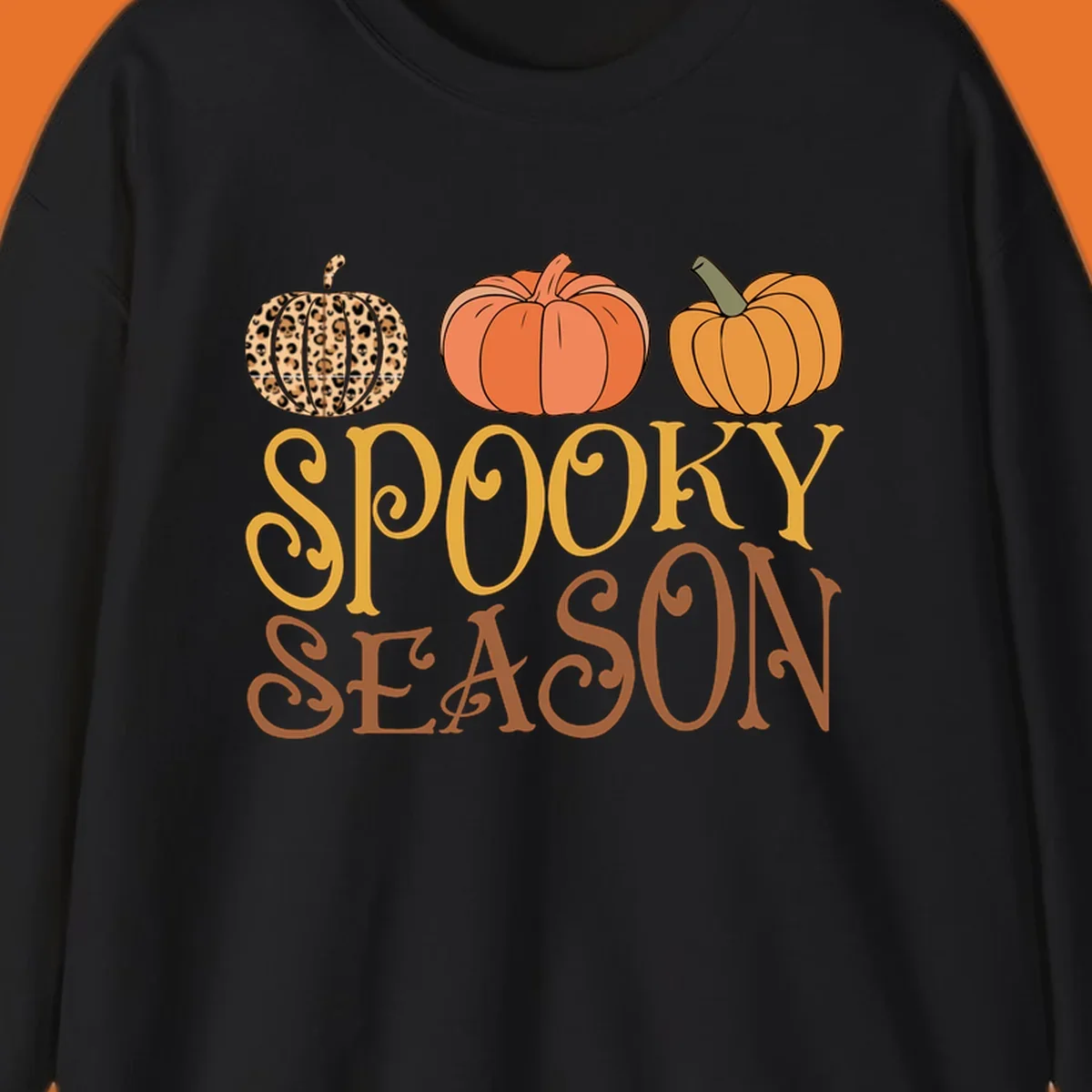 Spooky season pumpkins with leopard print and skull design, text: SPOOKY SEASON.