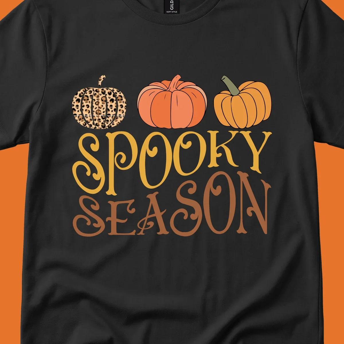 Spooky season pumpkins with leopard print and skull design, text: SPOOKY SEASON.