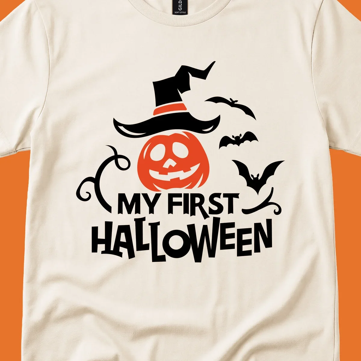 My First Halloween text with a pumpkin wearing a witch hat and bats.