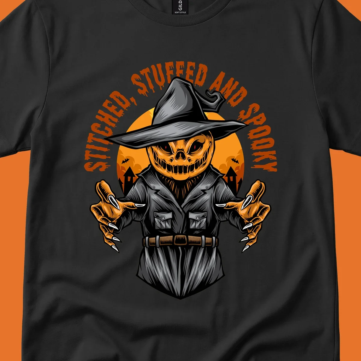 Spooky pumpkin character in a witch hat and suit, text reads STITCHED, STUFFED AND SPOOKY.
