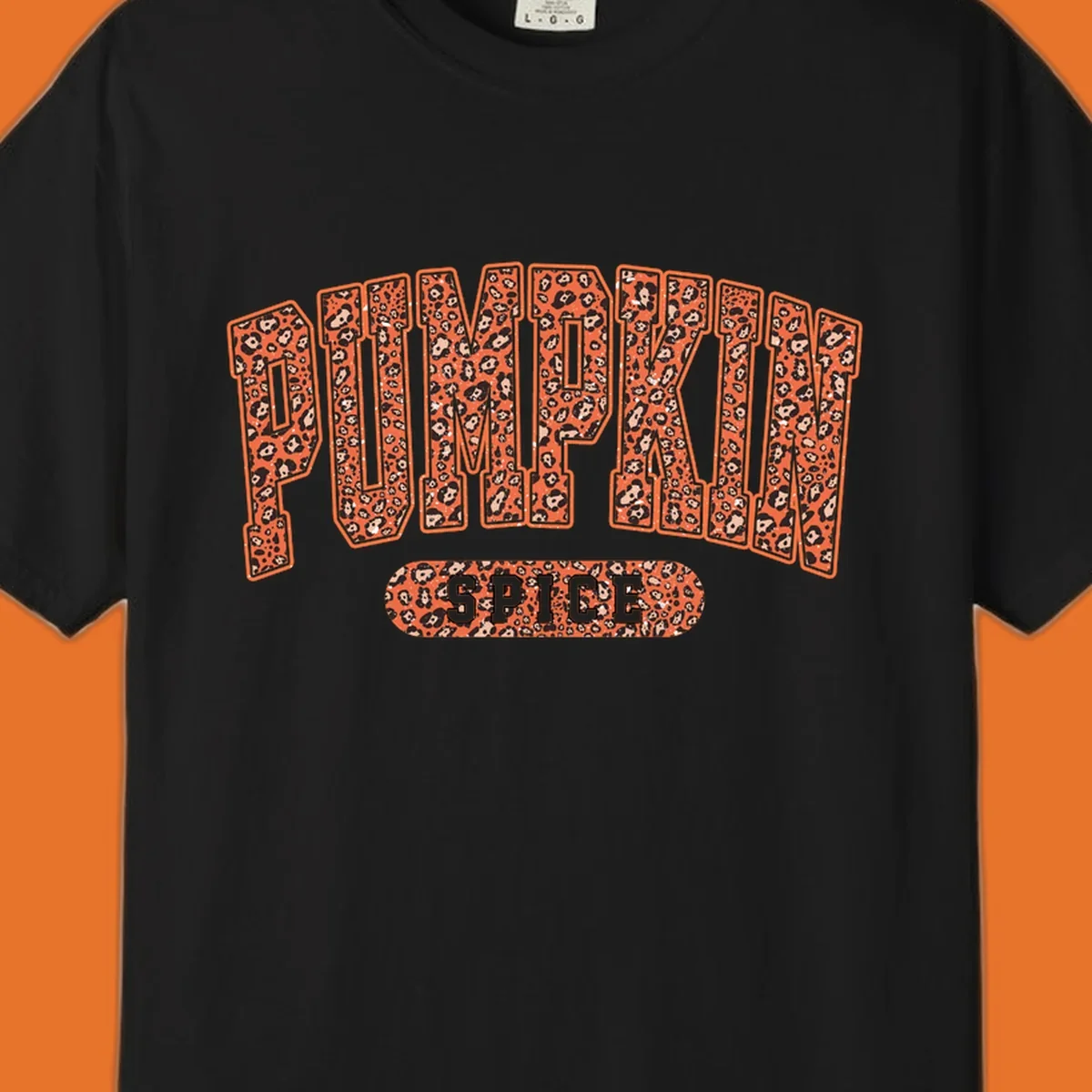 Pumpkin Spice text with leopard print pattern on dark outline, on black background.