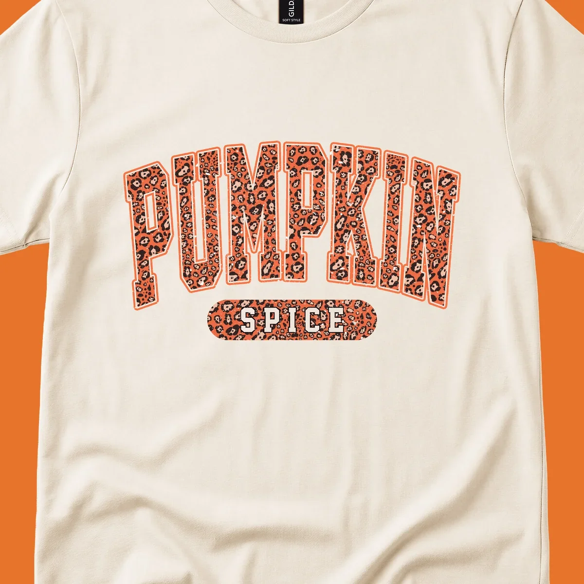 Pumpkin Spice text with leopard print pattern on dark outline, on black background.