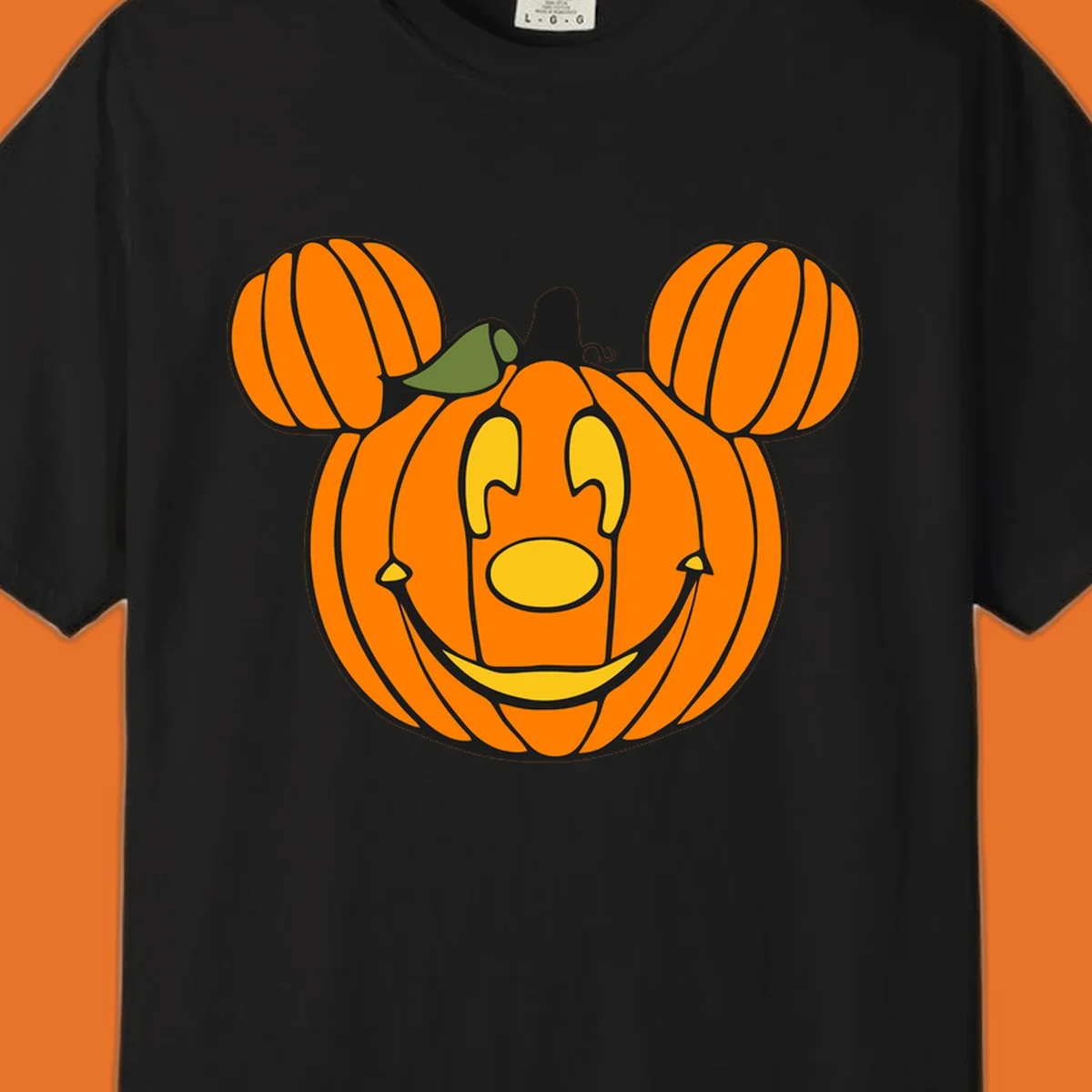Mickey pumpkin halloween jack-o-lantern graphic with smiling face and ears.