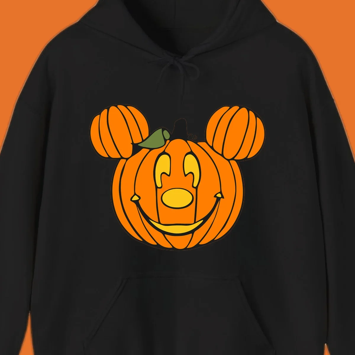 Mickey pumpkin halloween jack-o-lantern graphic with smiling face and ears.