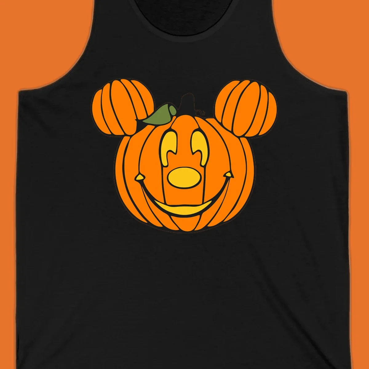 Mickey pumpkin halloween jack-o-lantern graphic with smiling face and ears.