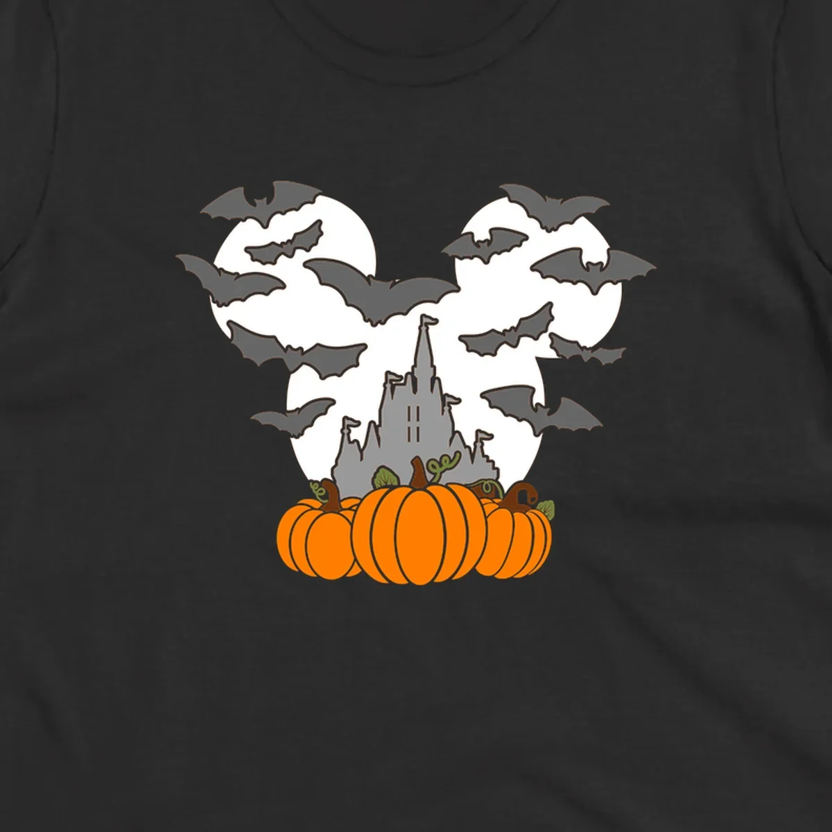 Halloween castle with bats and pumpkins against a Mickey Mouse ears moon graphic.