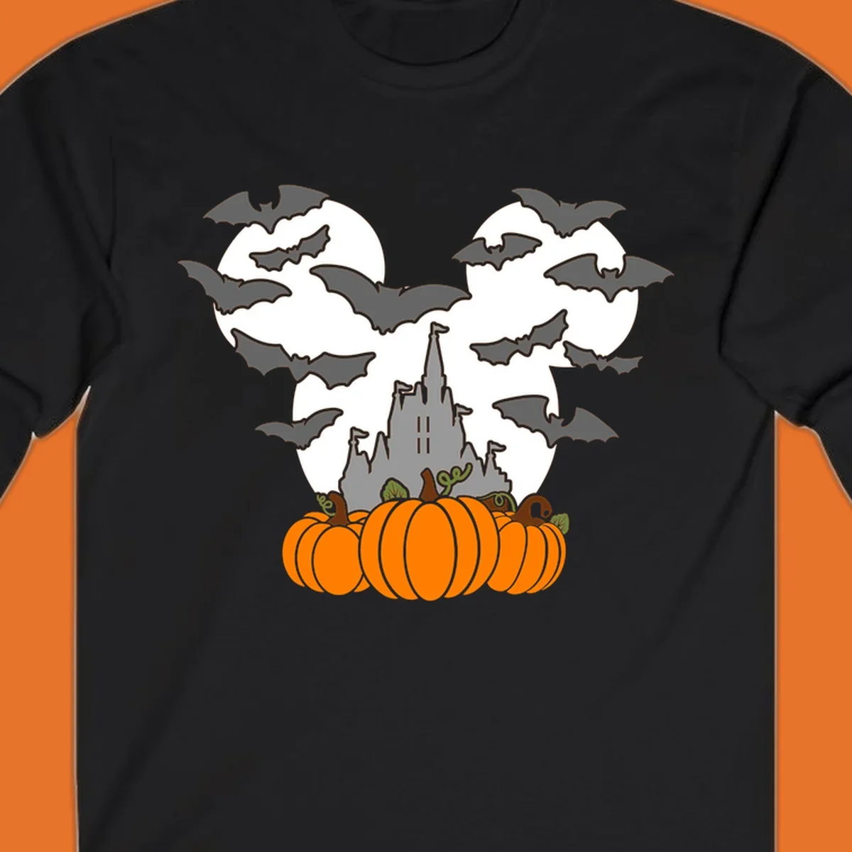 Halloween castle with bats and pumpkins against a Mickey Mouse ears moon graphic.
