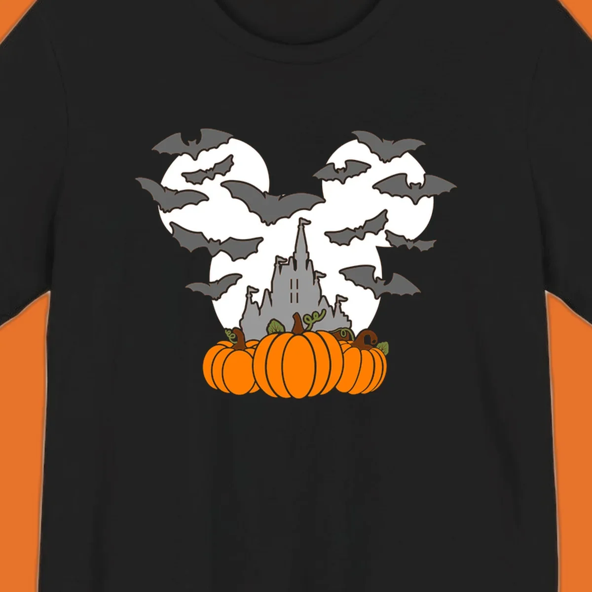 Halloween castle with bats and pumpkins against a Mickey Mouse ears moon graphic.