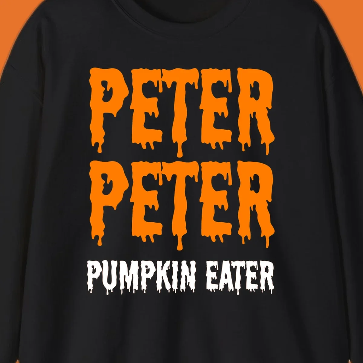 Peter Peter Pumpkin Eater text design with dripping orange and white letters on a black background.