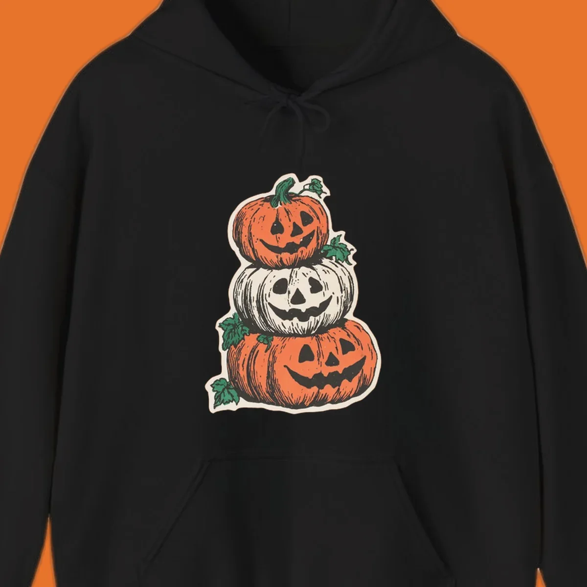 Stacked Halloween jack-o'-lanterns graphic with leaves for fall holiday shirts.