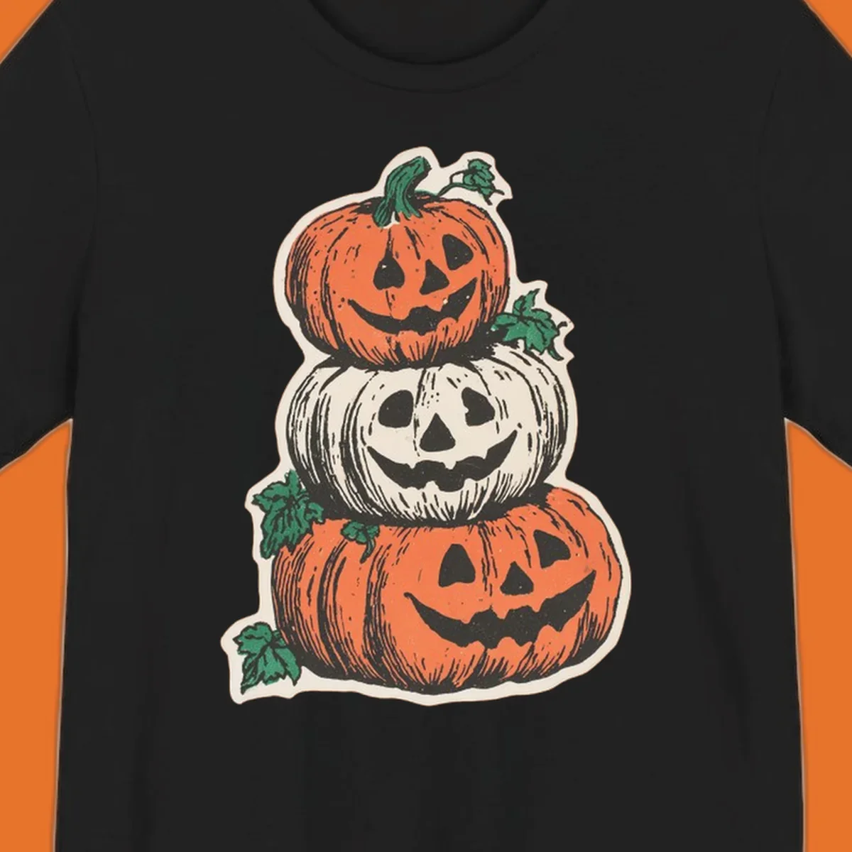 Stacked Halloween jack-o'-lanterns graphic with leaves for fall holiday shirts.