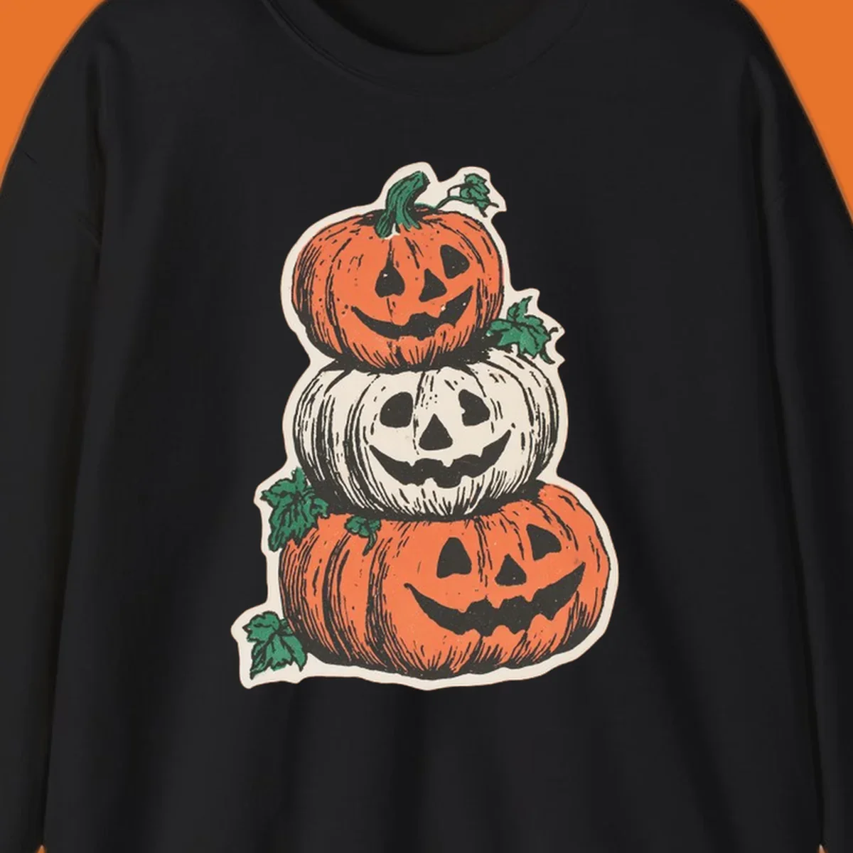 Stacked Halloween jack-o'-lanterns graphic with leaves for fall holiday shirts.