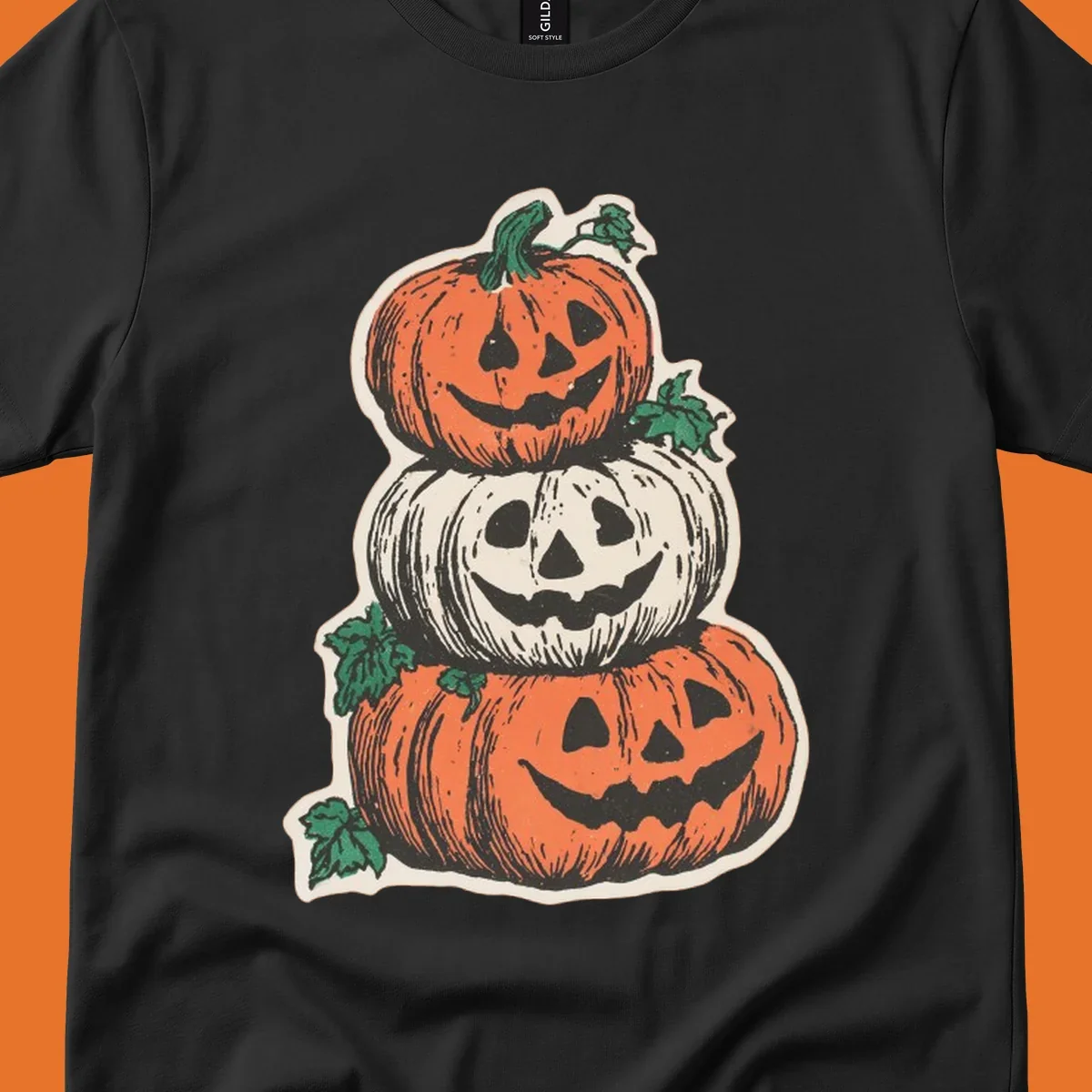 Stacked Halloween jack-o'-lanterns graphic with leaves for fall holiday shirts.