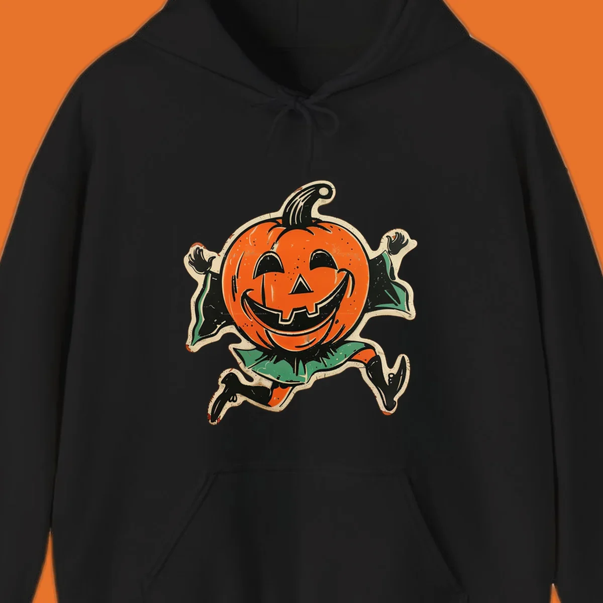 Vintage running jack-o'-lantern graphic with a big smile, black boots, and green leaves.